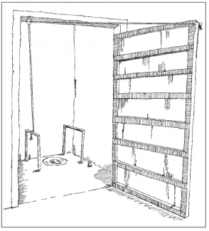 Toilet where a rope is attached to the door threads through a hook